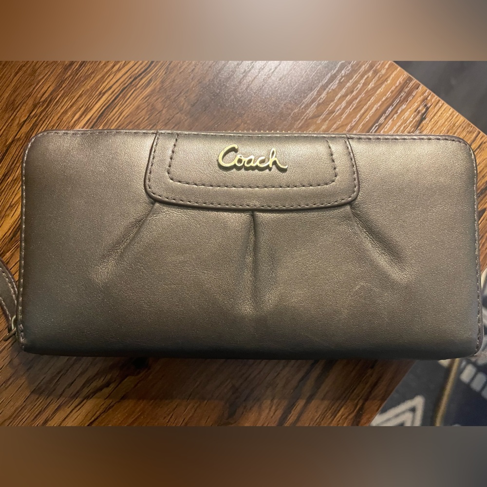 Coach wallet. Minor wear on inside card slot two areas.
